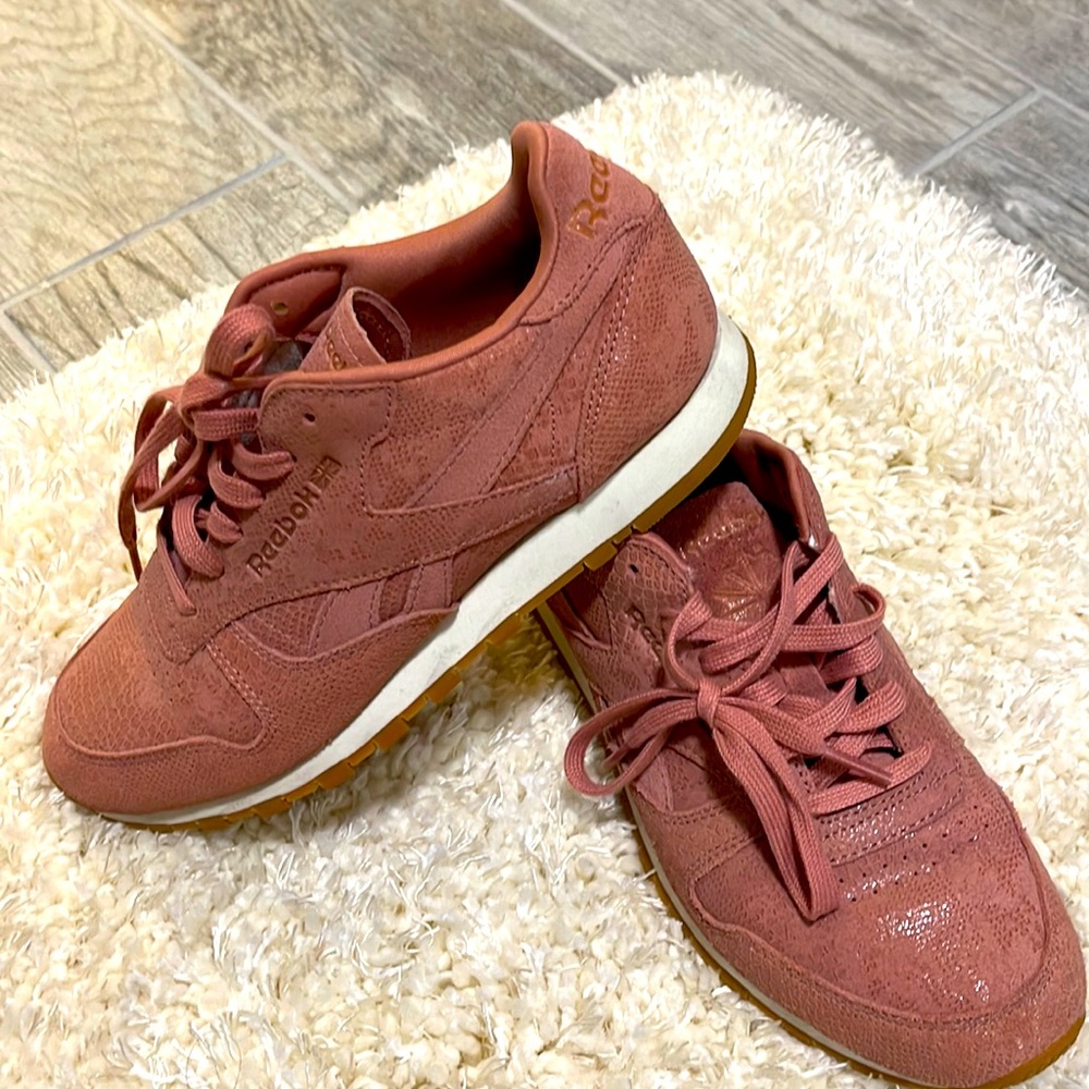 Reebok classic sneakers with detailing on them pink-ish color
